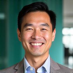 Professional headshot of David Tan, a FinLykke Edu financial advisor with a friendly expression.
